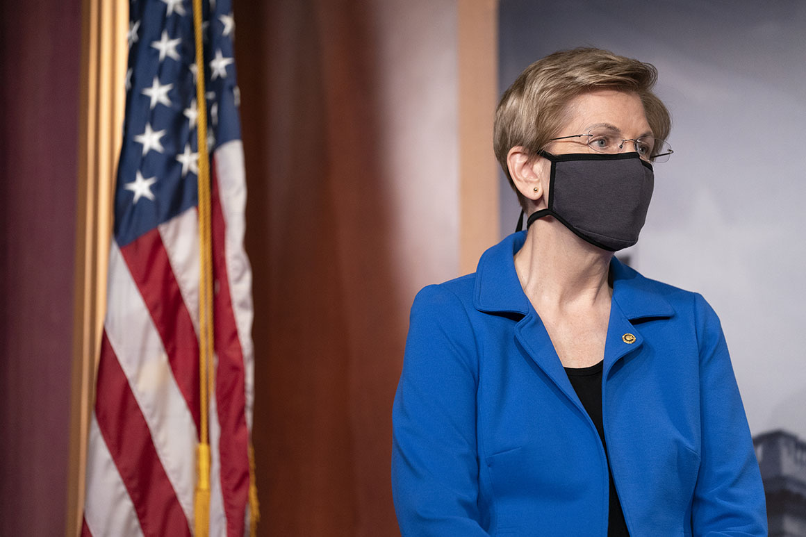 Sen. Elizabeth Warren listens during a news conference on Capitol Hill on Oct. 20, 2020.