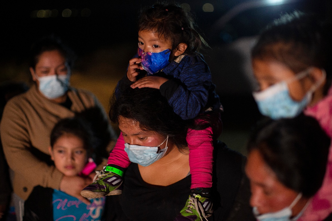 Migrant families coming from Guatemala wait at a U.S. Border Patrol intake site at Roma, Texas. 