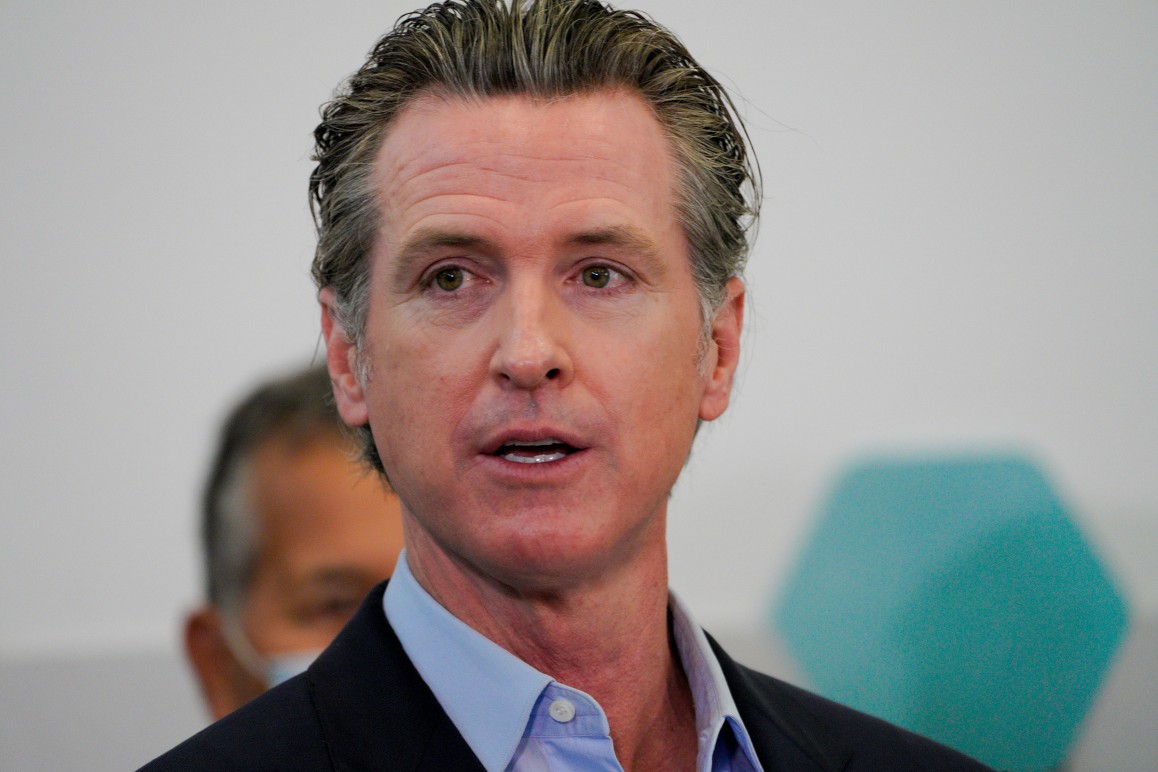 Governor Gavin Newsom speaks with reporters in San Diego.