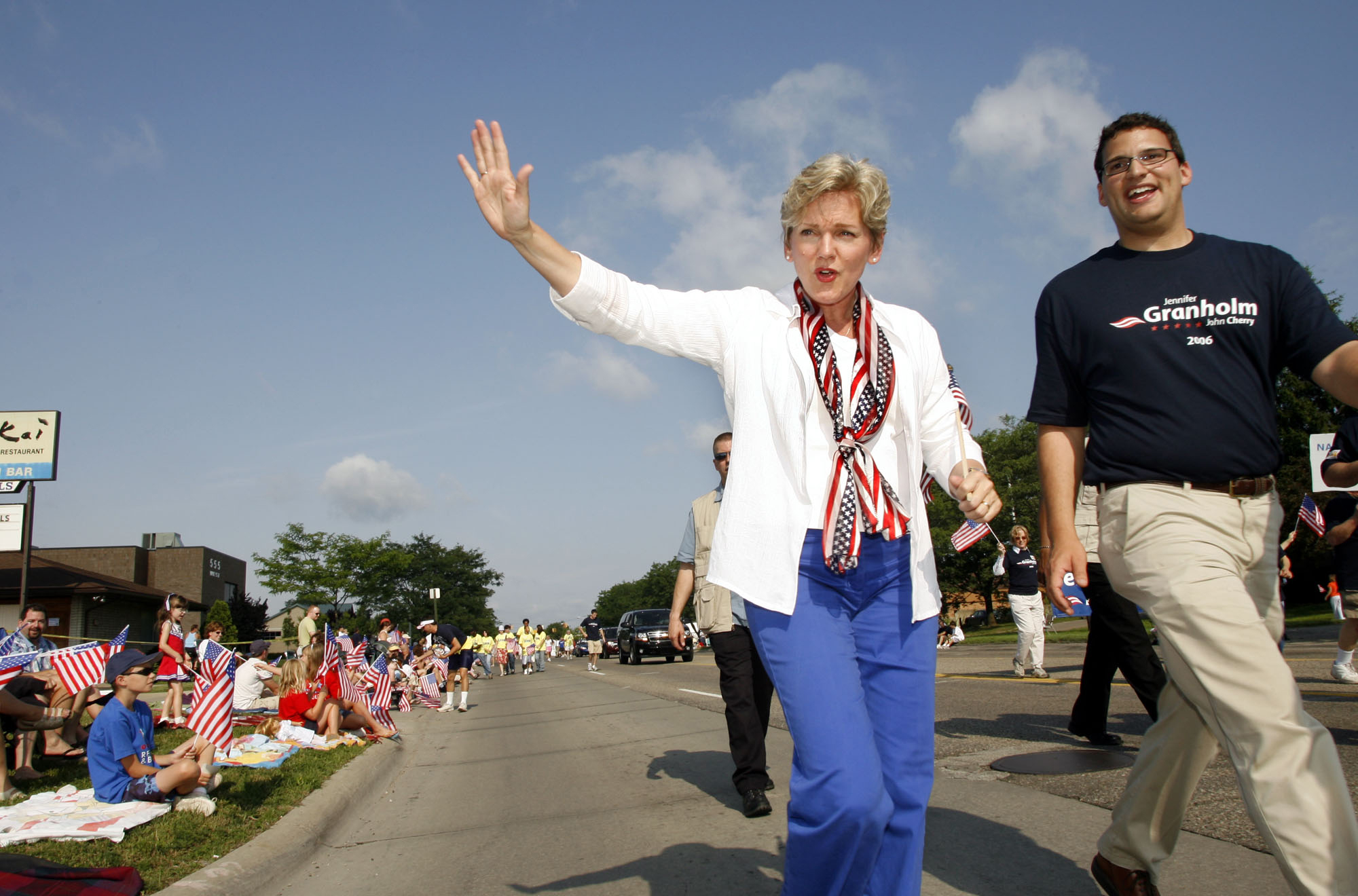 At a 2006 Fourth of July parade in Clawson, Mich., then-Gov. Jennifer Granholm marches with County Commissioner Dave Woodward.