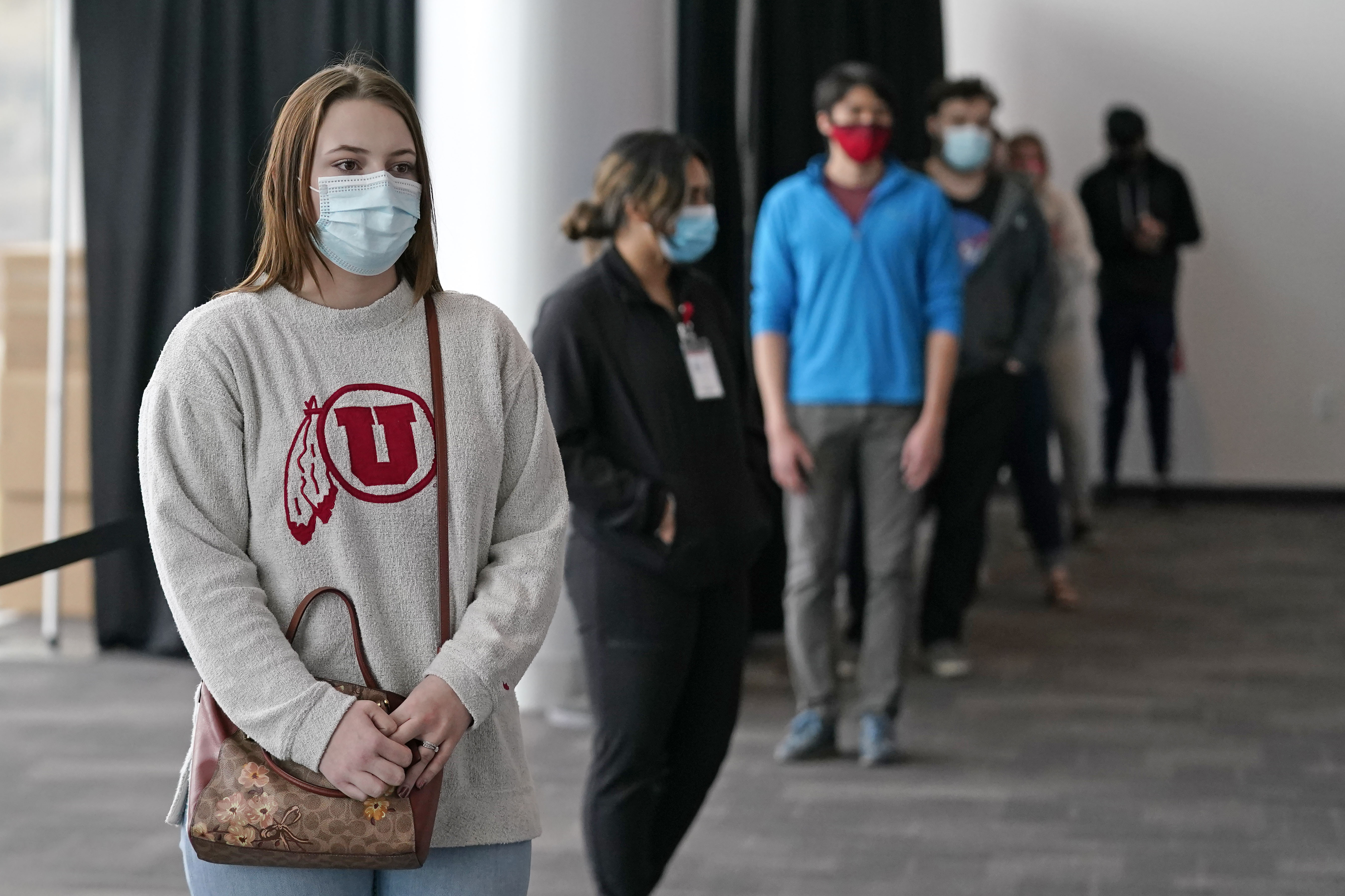 University of Utah student Abigail Shull waits in line before taking a rapid Covid-19 test at the University of Utah student testing site on Wednesday, Nov. 18, 2020, in Salt Lake City.