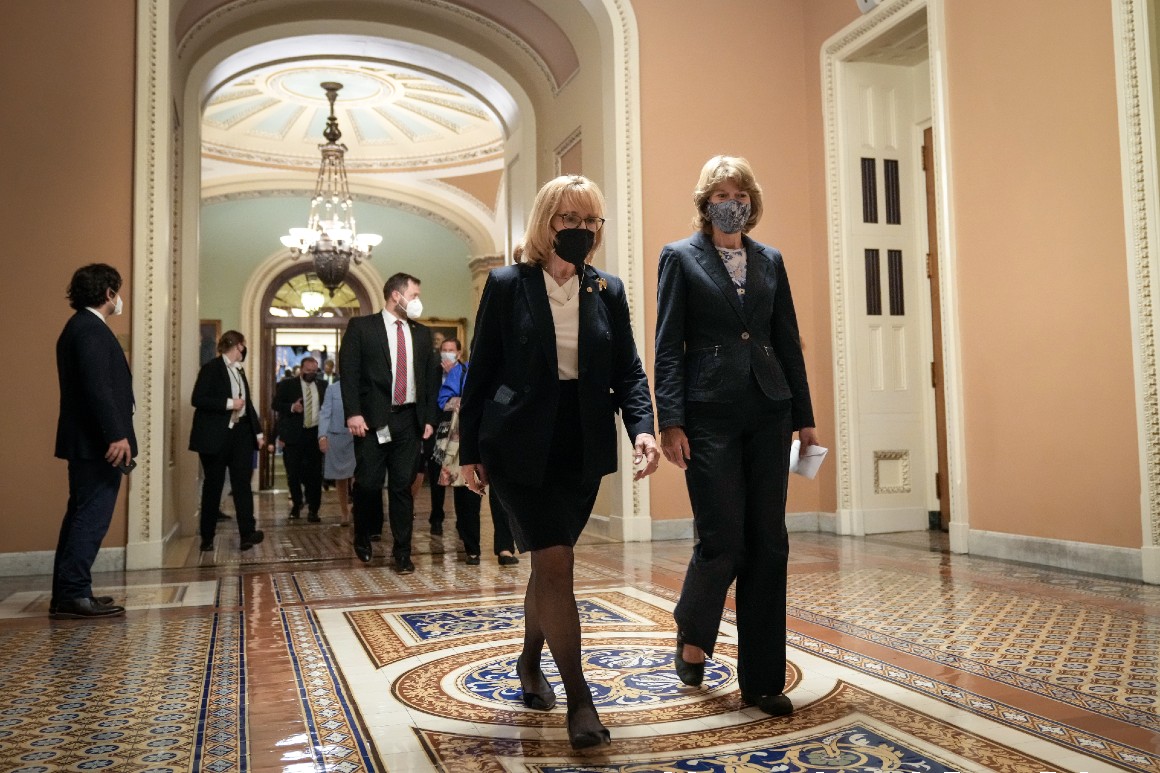 Democratic Sen. Maggie Hassan walks alongside Republican Sen. Lisa Murkowski of Alaska. 