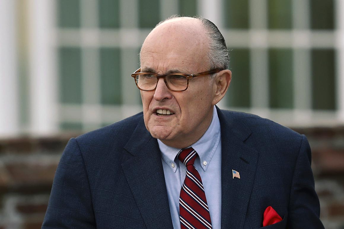 Former New York Mayor Rudy Giuliani arrives at the Trump National Golf Club Bedminster clubhouse.