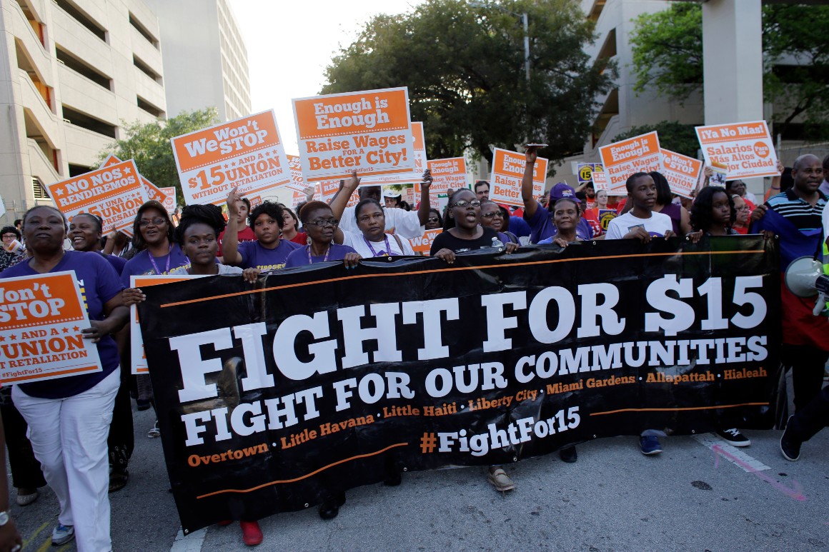 A national coalition of labor unions, along with racial and social justice organizations, march in support of raising the minimum wage to $15 an hour.