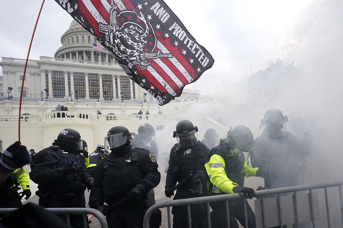 Police hold off supporters of Donald Trump who tried to break through a police barrier at the Capitol in Washington, D.C., on Jan. 6, 2021.