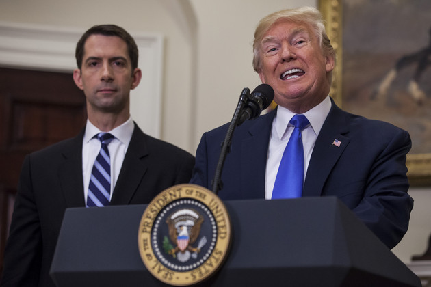 Donald Trump speaks in the Roosevelt Room at the White House as Tom Cotton listens.