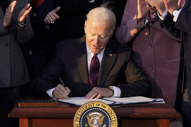 President Joe Biden signs the infrastructure bill into law.