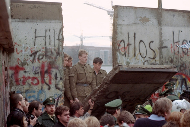 East German border guards at the Berlin Wall, 1989.