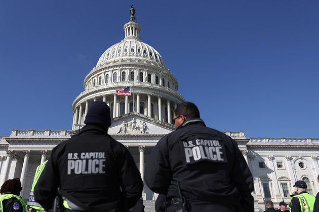 U.S. Capitol police officers gather on the east front plaza of the Capitol.