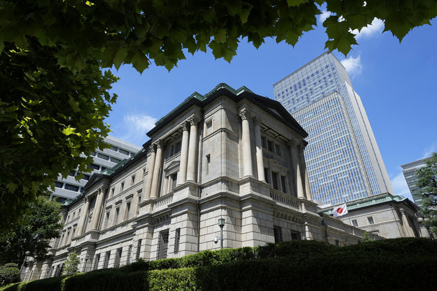 A Japanese flag flutters at the Bank of Japan headquarters. 
