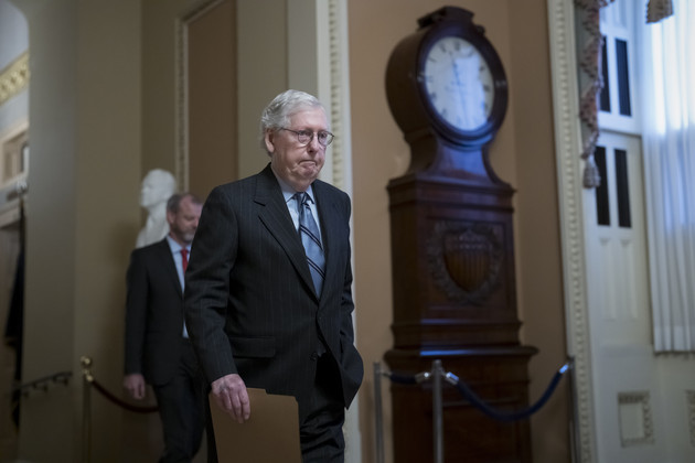 Senate Minority Leader Mitch McConnell walks to the chamber. 