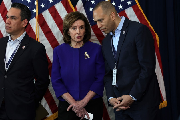 Speaker of the House Nancy Pelosi, center, Rep. Pete Aguilar, left, and Democratic Caucus Chair Hakeem Jeffries listen during a news conference.