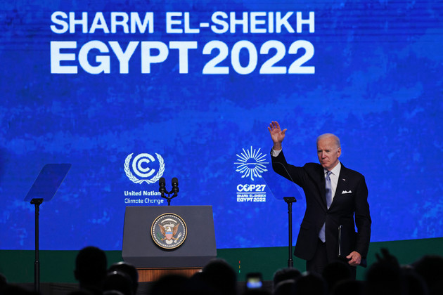 Joe Biden waves after speaking at the UNFCCC COP27 climate conference.