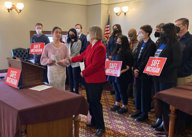 Reina St. Juliana, a student at Oxford High School, thanks Sen. Rosemary Bayer, front right, for sponsoring a bill for safe gun storage.