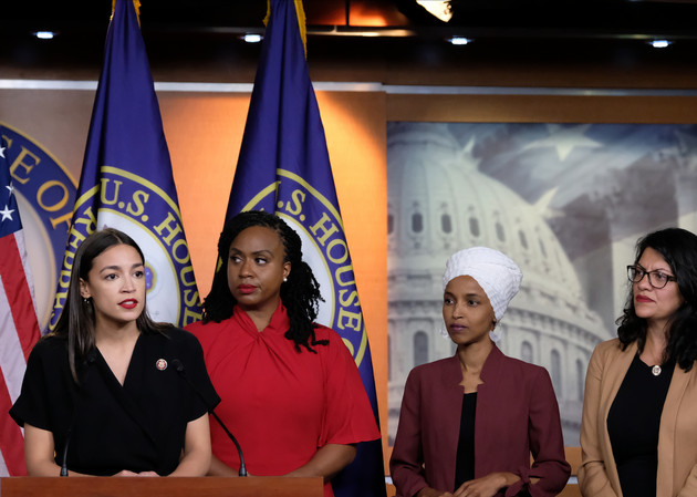 Alexandria Ocasio-Cortez (D-NY) speaks as Reps. Ayanna Pressley (D-MA), Ilhan Omar (D-MN), and Rashida Tlaib (D-MI) listen during a press conference at the US Capitol.