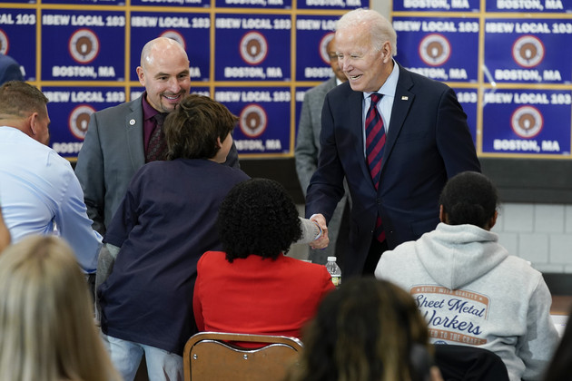President Joe Biden greets people as he visits a phone bank at International Brotherhood of Electrical Workers Local 103.