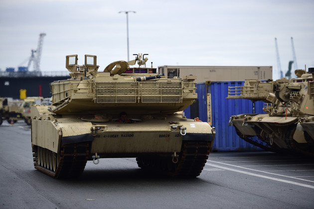 An M1 Abrams tank is pictured being ready to load onto a train at a port in Bremerhaven, Germany.