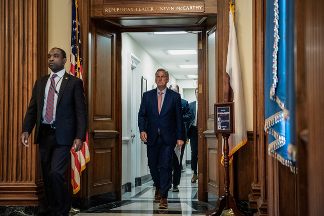 Kevin McCarthy walking through a doorway with his name and Republican Leader written above it.