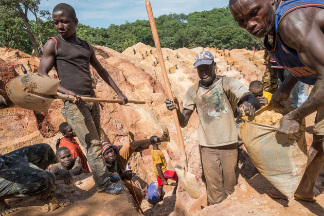Gold miners work in the Ndassima gold mine.