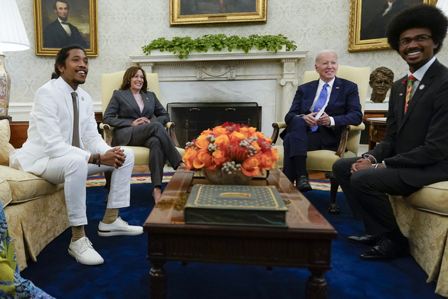 Justin Jones, Kamala Harris, Joe Biden and Justin Pearson sit in the Oval Office.