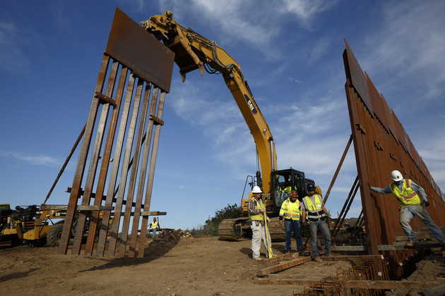 Construction crews install new border wall sections seen from Tijuana, Mexico, Jan. 9, 2019. 