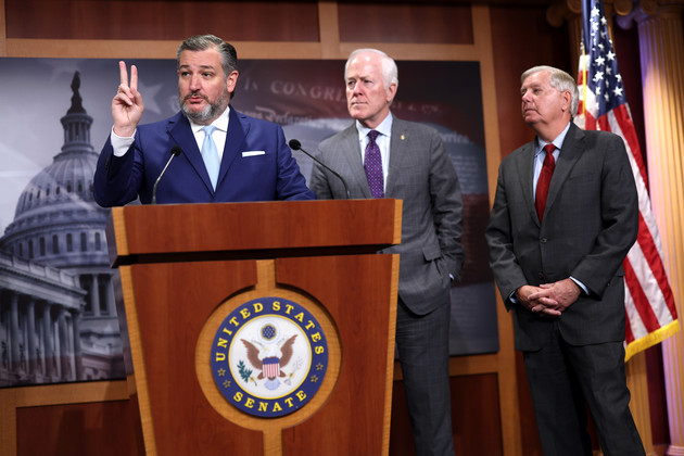 Sen. Ted Cruz, left, joined by Sens. John Cornyn, center, and Lindsey Graham, right, speak at a press conference.
