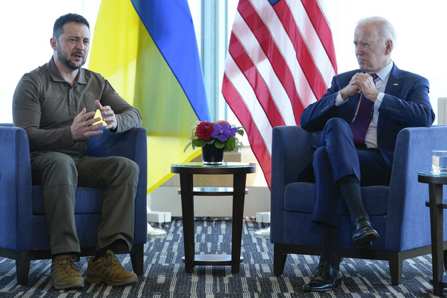 Ukrainian President Volodymyr Zelenskyy gestures during a meeting with President Joe Biden.