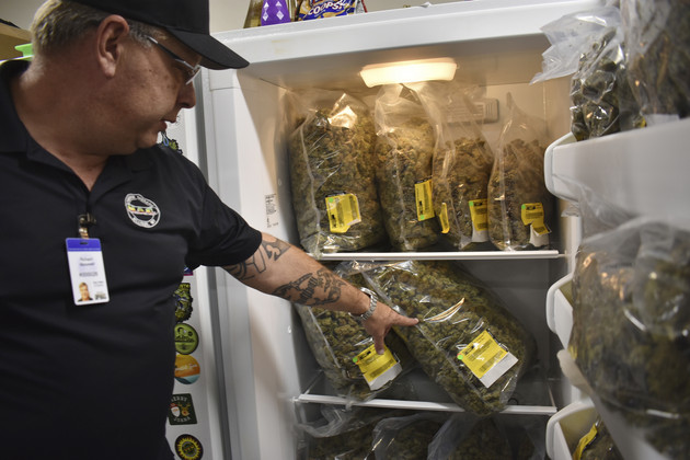 Montana Advanced Caregivers owner Richard Abromeit talks about different strains of marijuana stored in a refrigerator at the Billings, Mont., medical marijuana dispensary on Nov. 11, 2020.