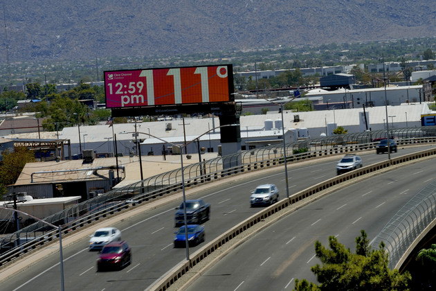 A digital billboard displays an unofficial temperature in downtown Phoenix.