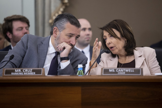 Ted Cruz Maria Cantwell converse during a hearing.