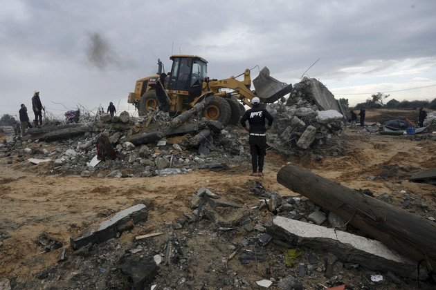 Palestinians search for the bodies after an Israeli strike in Zuweida, Gaza Strip.